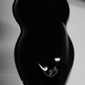 High-gloss black paint swatch photographed
