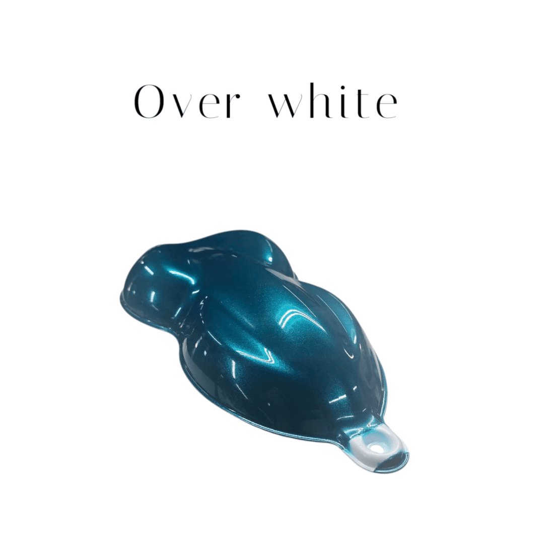 Teal metallic paint sample over white
